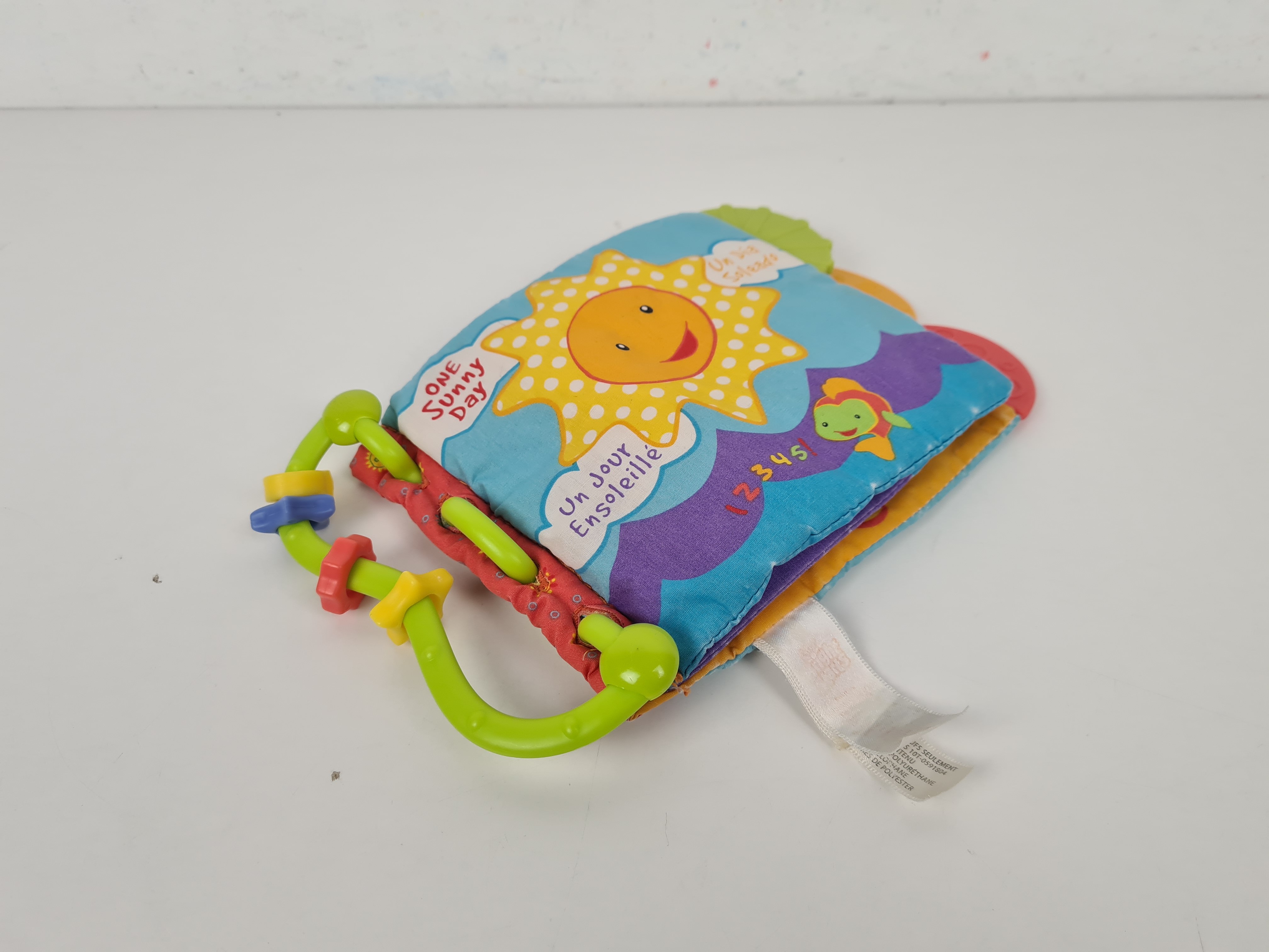 Jeu d'éveil - Livre en tissu avec anneaux de dentition Soleil - 0/3 ans - Photo 2