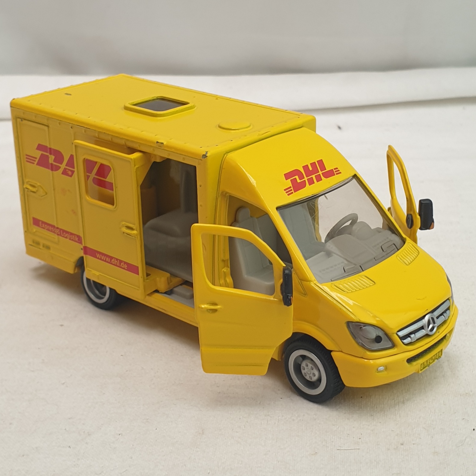 Fourgon de livraison DHL - Siku  - Bon état sur Label Emmaüs