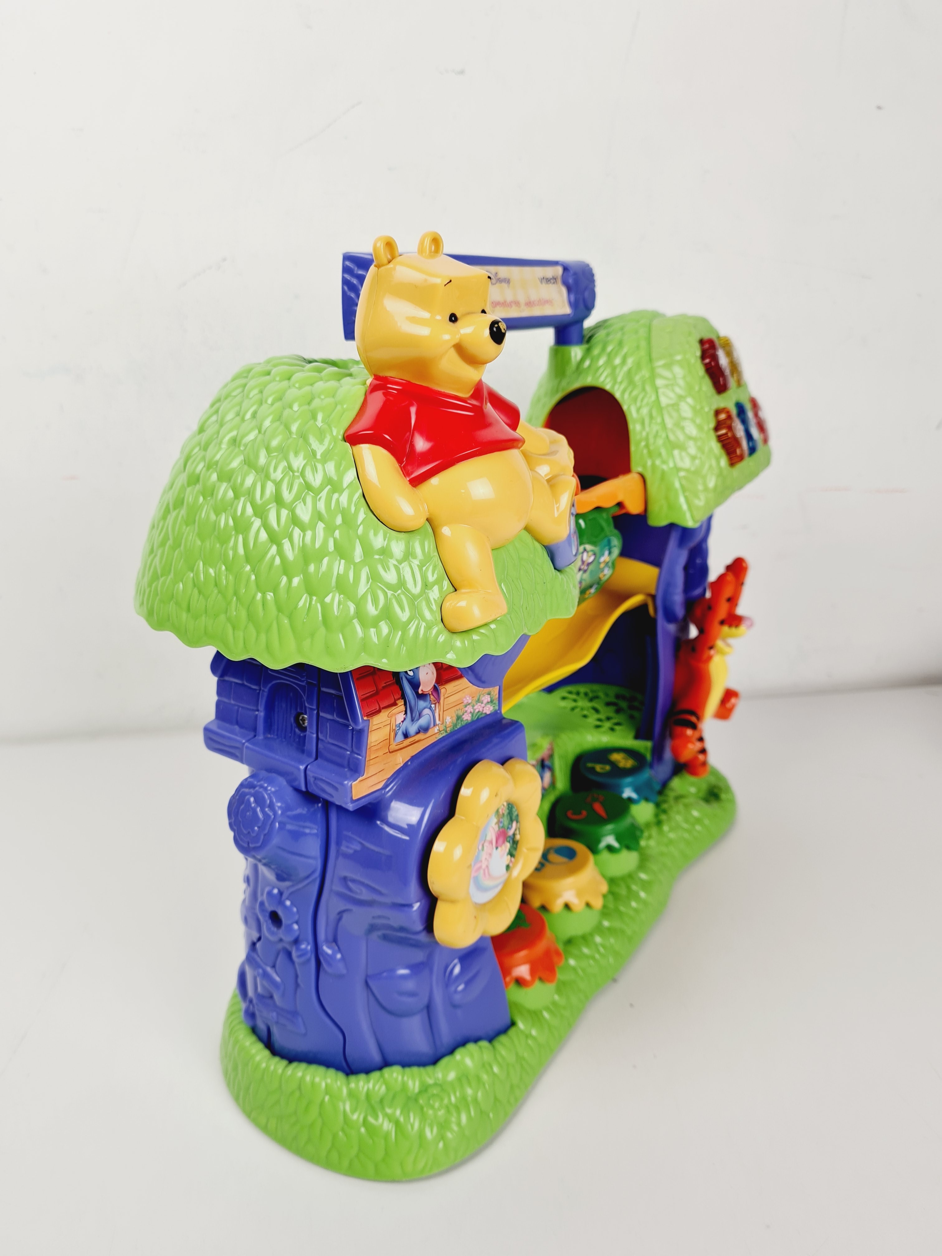 Voir photo 3 de Jouet 1er âge - L'arbre des aventures multi-activités - Winnie l'Ourson - Vtech - Dès 12 mois Jouet 1er âge - L'arbre des aventures multi-activités - Winnie l'Ourson - Vtech - Dès 12 mois Bon état - Vue 3 -