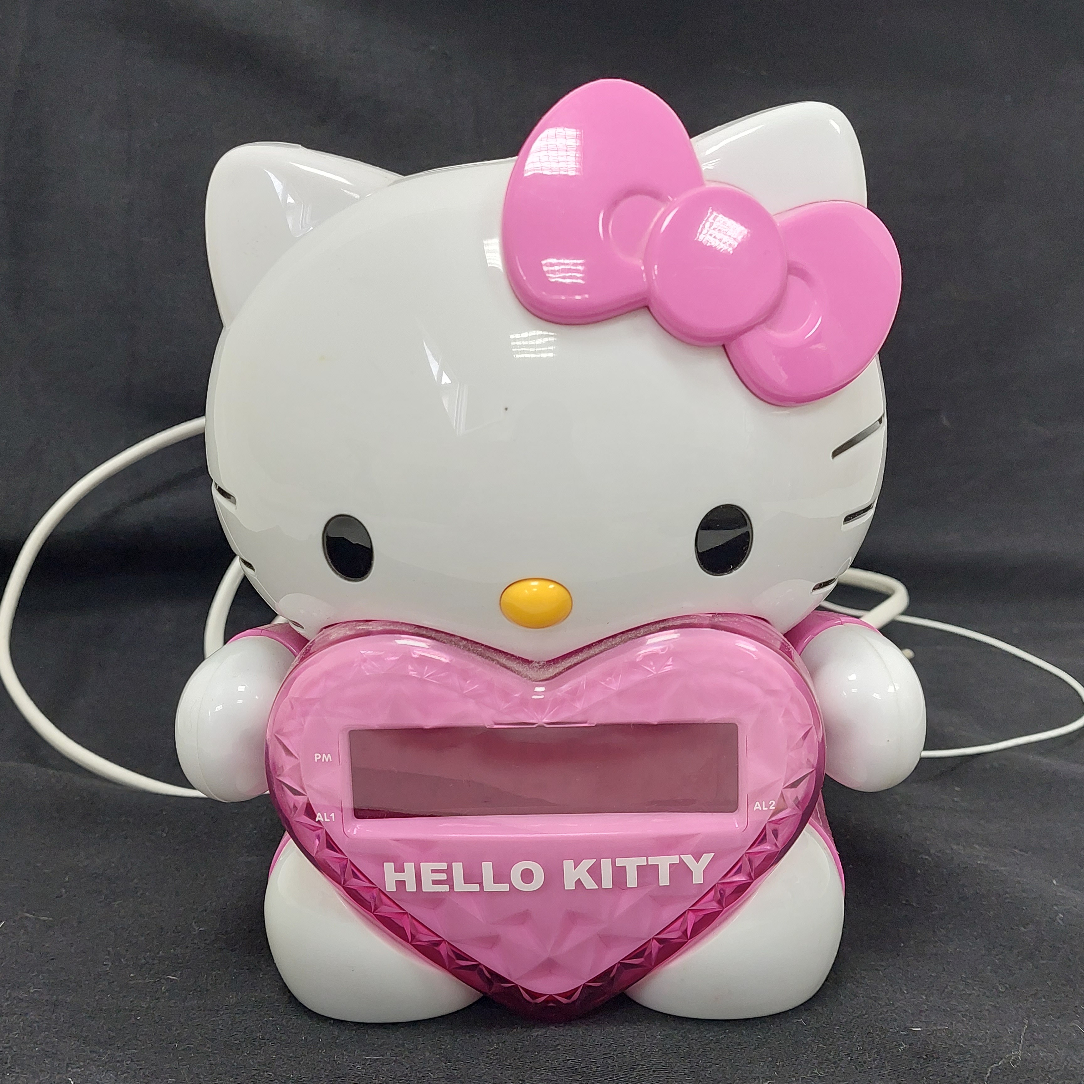 Radio réveil- Hello Kitty - projection murale de l'heure - Sanrio - 2013 Très bon état -  reconditionné disponible sur Label Emmaüs