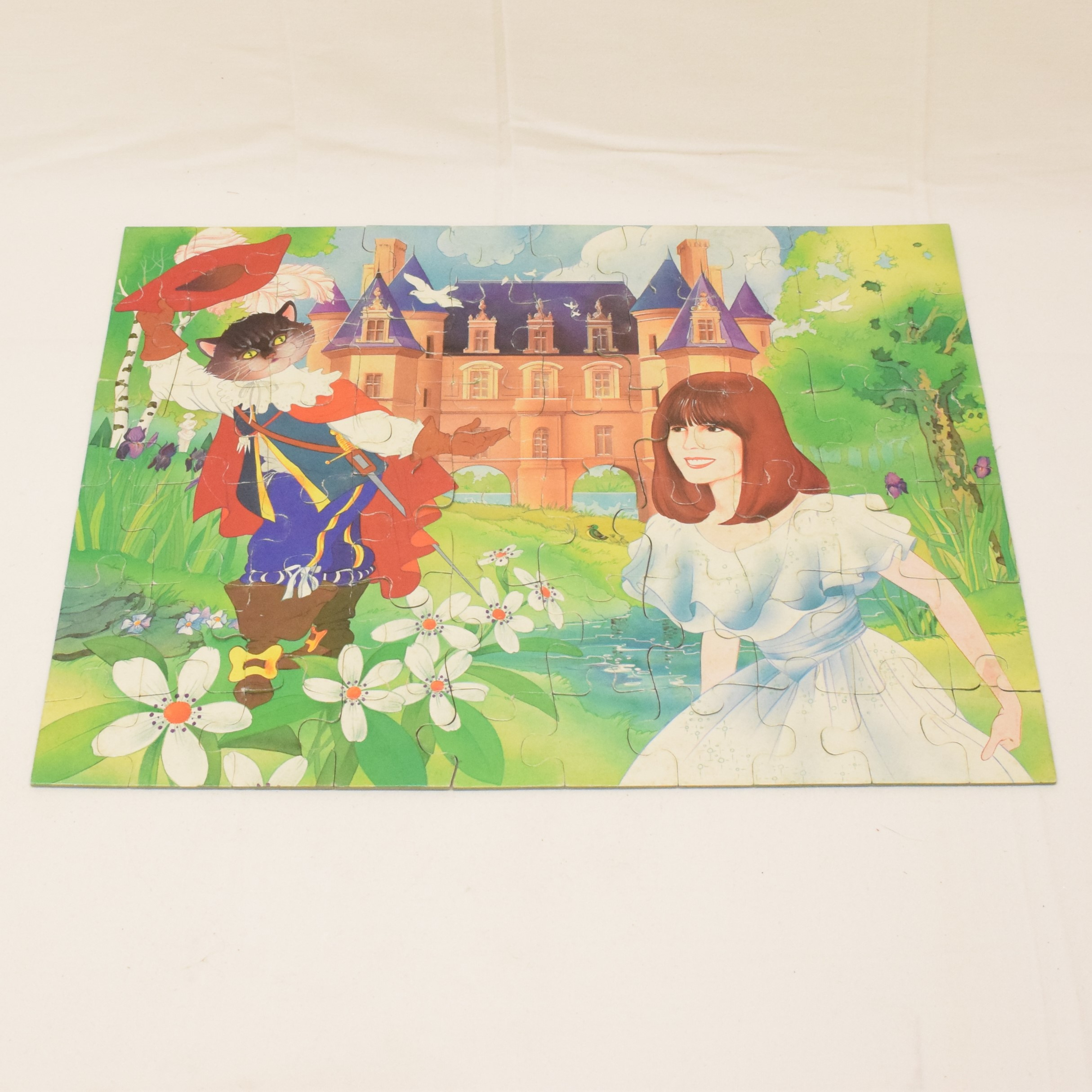 Voir photo 4 de Puzzle 60 pièces Chantal Goya le chat botté jeux Nathan 1983 Puzzle 60 pièces Chantal Goya le chat botté jeux Nathan 1983 État correct - Vue 4 -
