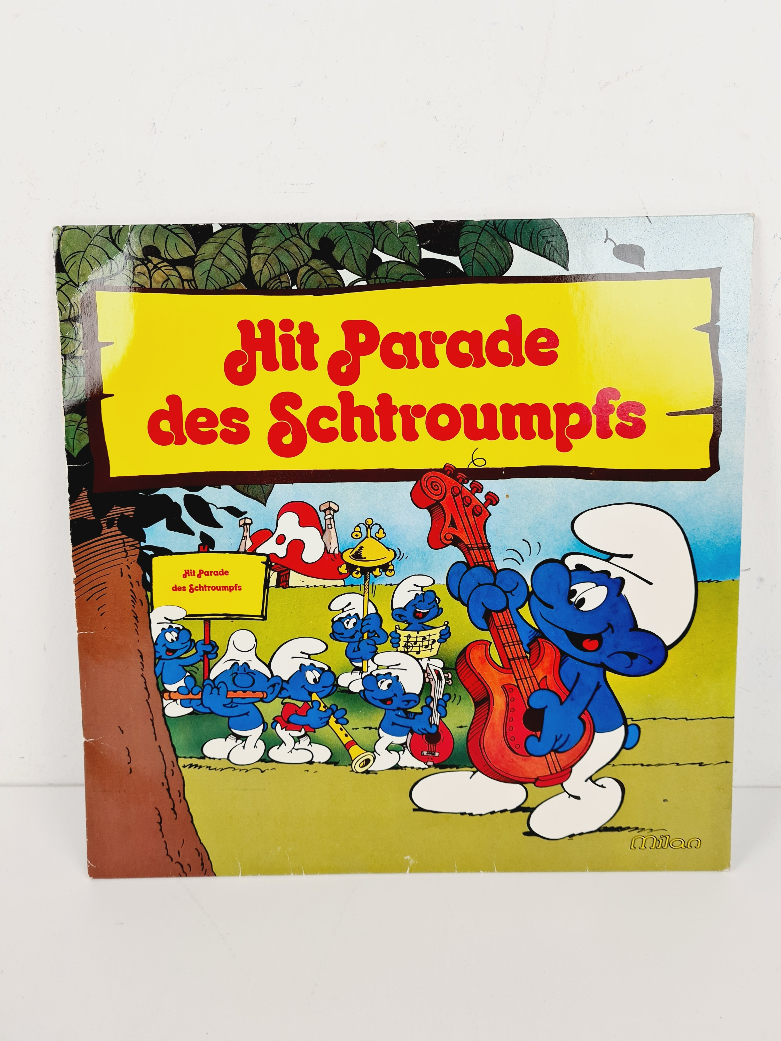 Voir photo 2 de Disque Vinyle Collection 1981 - Hit Parade des Schtroumpfs - Milan - 30x30 cm Disque Vinyle Collection 1981 - Hit Parade des Schtroumpfs - Milan - 30x30 cm Bon état - Vue 2 -