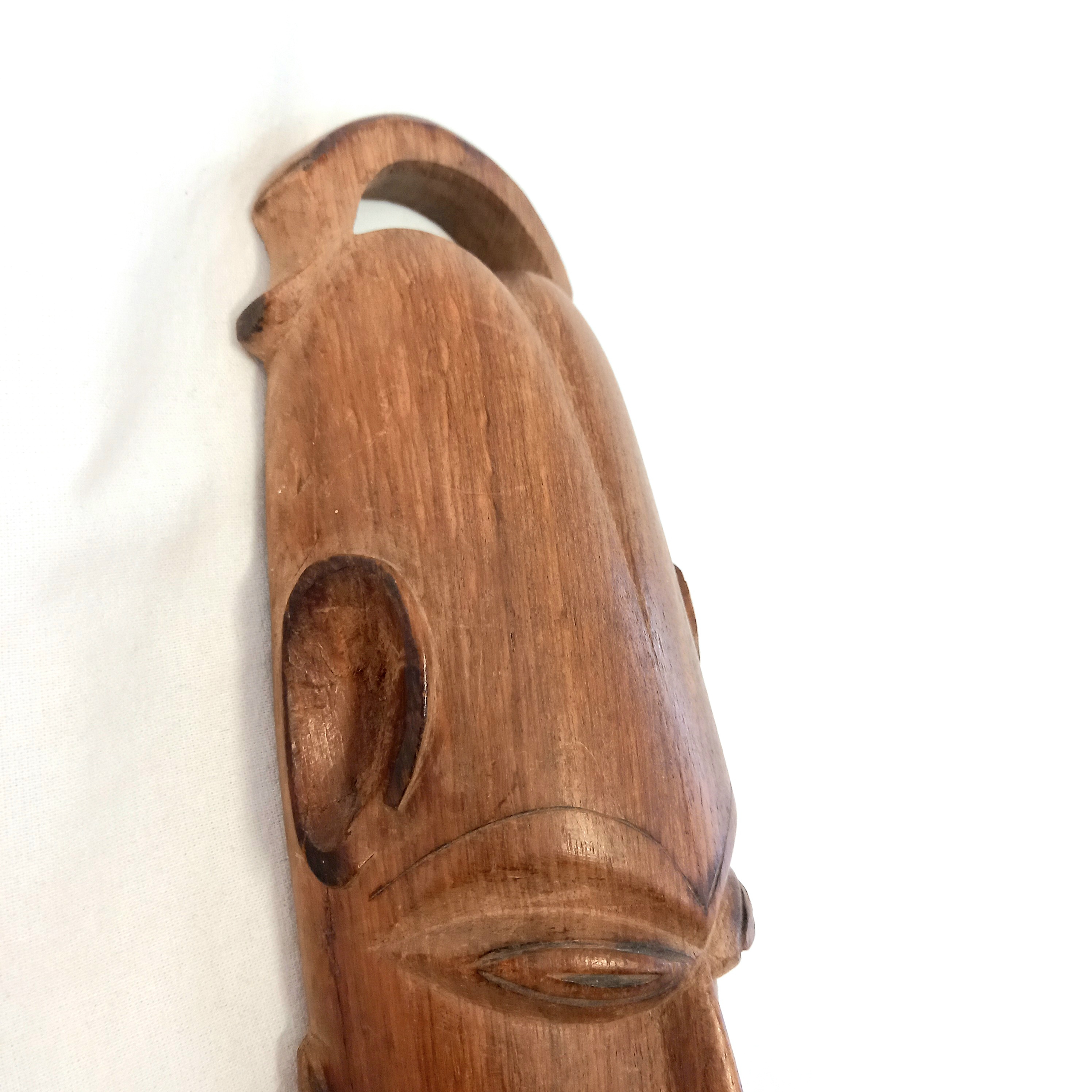 Statuette de masque Africain en bois sculpté - Photo 1