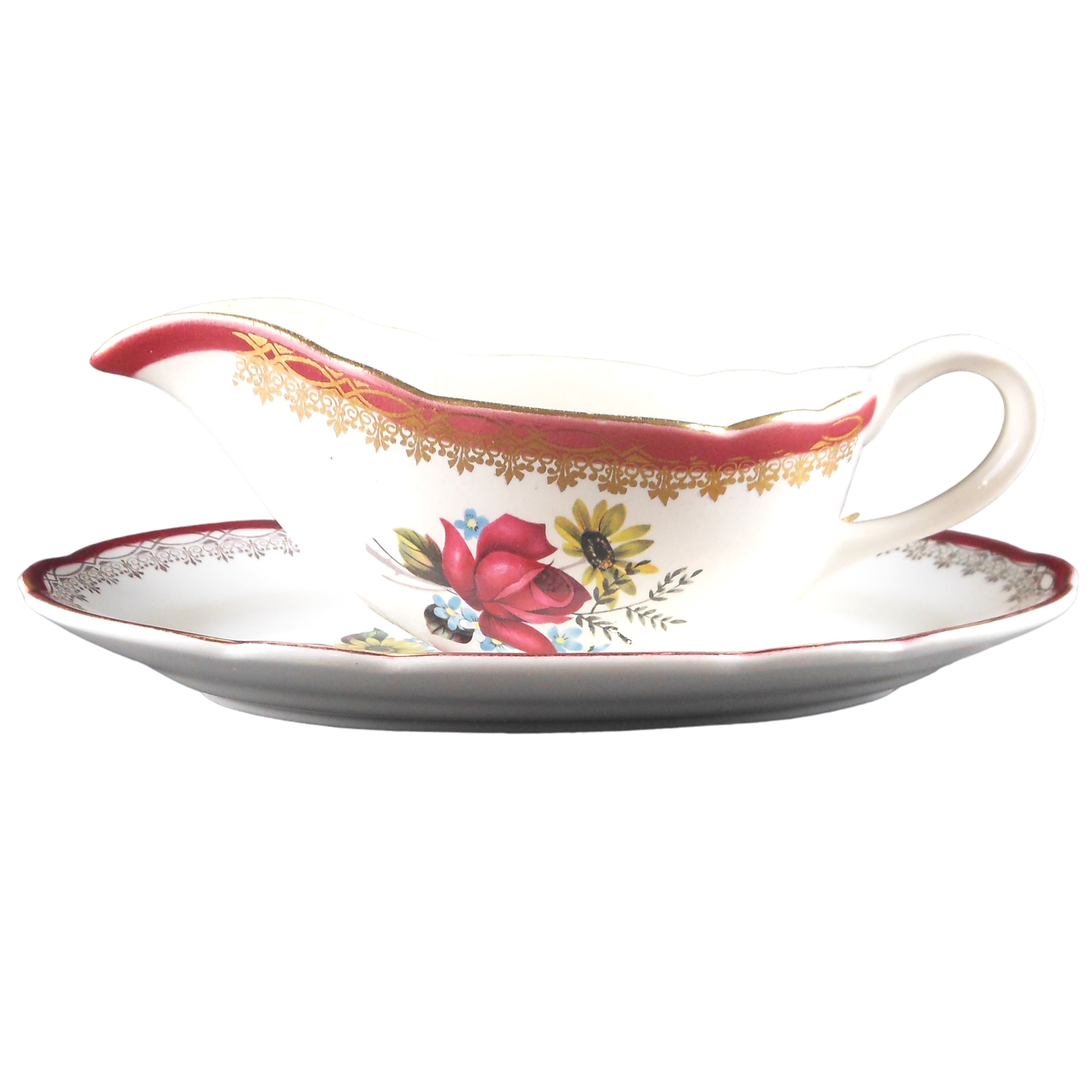 Saucière motif fleuri en céramique , petite ébréchure rien de méchant - Bon état sur Label Emmaüs