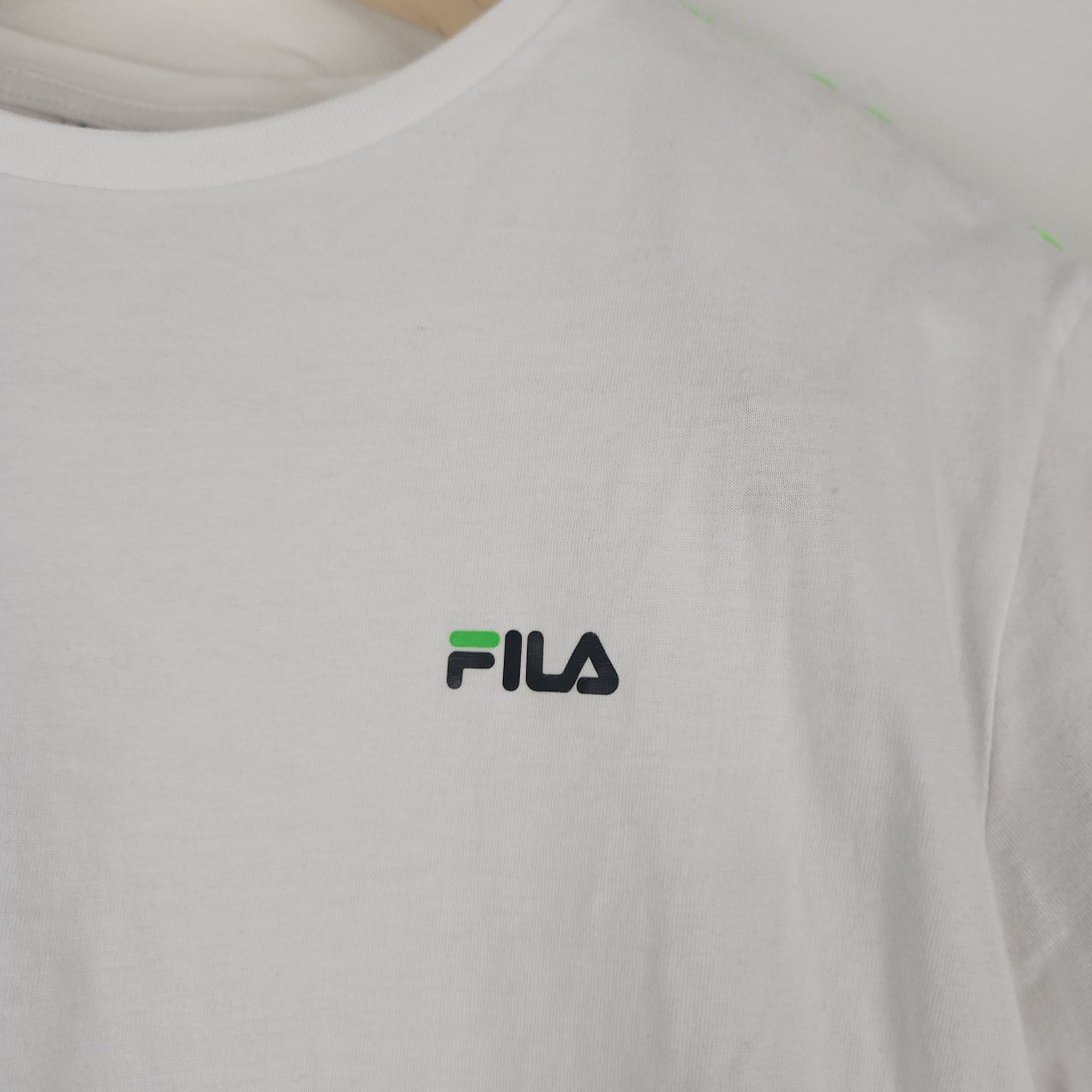 Voir photo 2 de Fila - t-shirt blanc en coton - Taille S – mesures Carrure Poitrine 42 cm Longueur= 62 cm Fila - t-shirt blanc en coton - Taille S – mesures Carrure Poitrine 42 cm Longueur= 62 cm - Vue 2 -