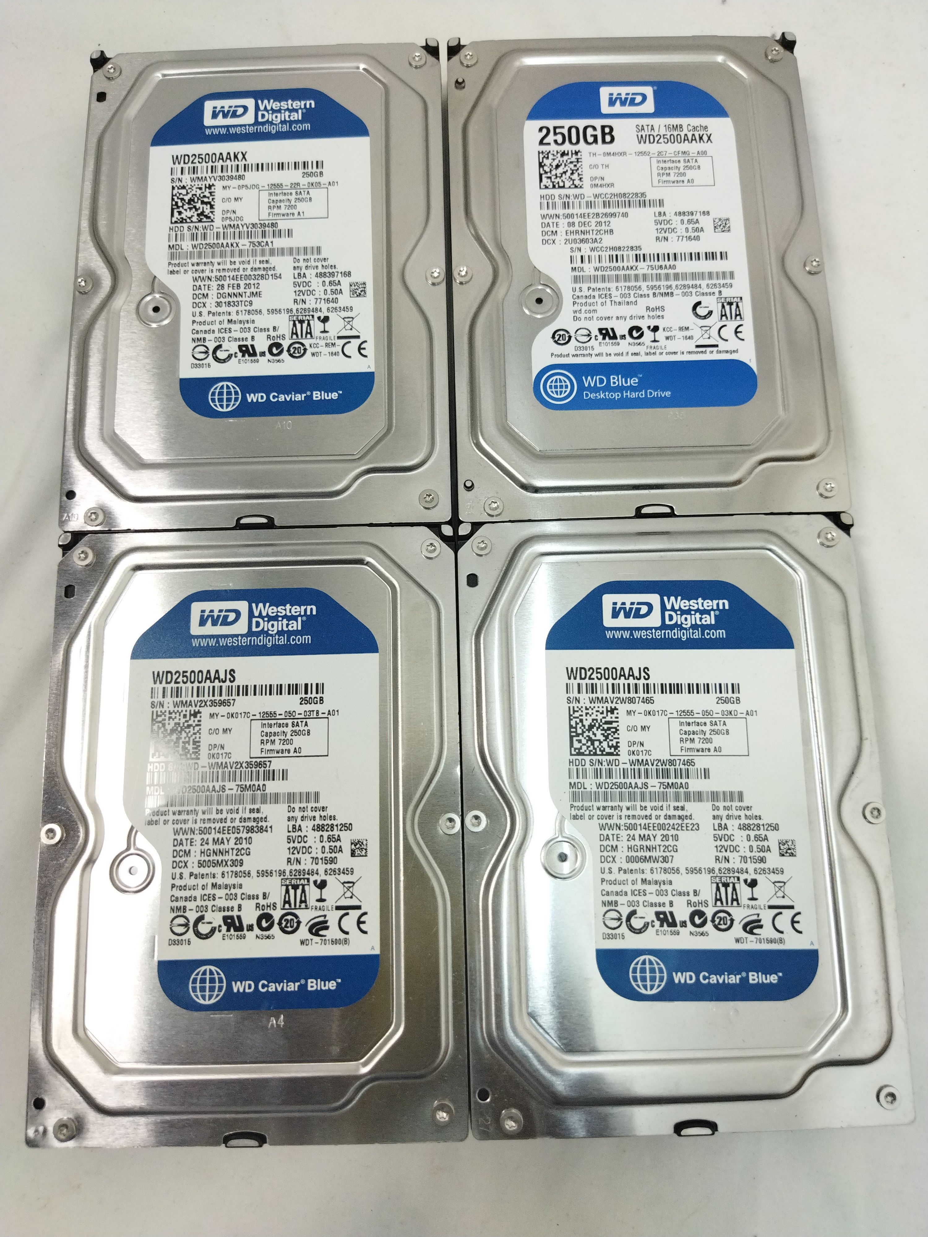 Voir photo 3 de Un lot de 4x disques durs -250 Go HDD en très bon état Un lot de 4x disques durs -250 Go HDD en très bon état - Vue 3 -