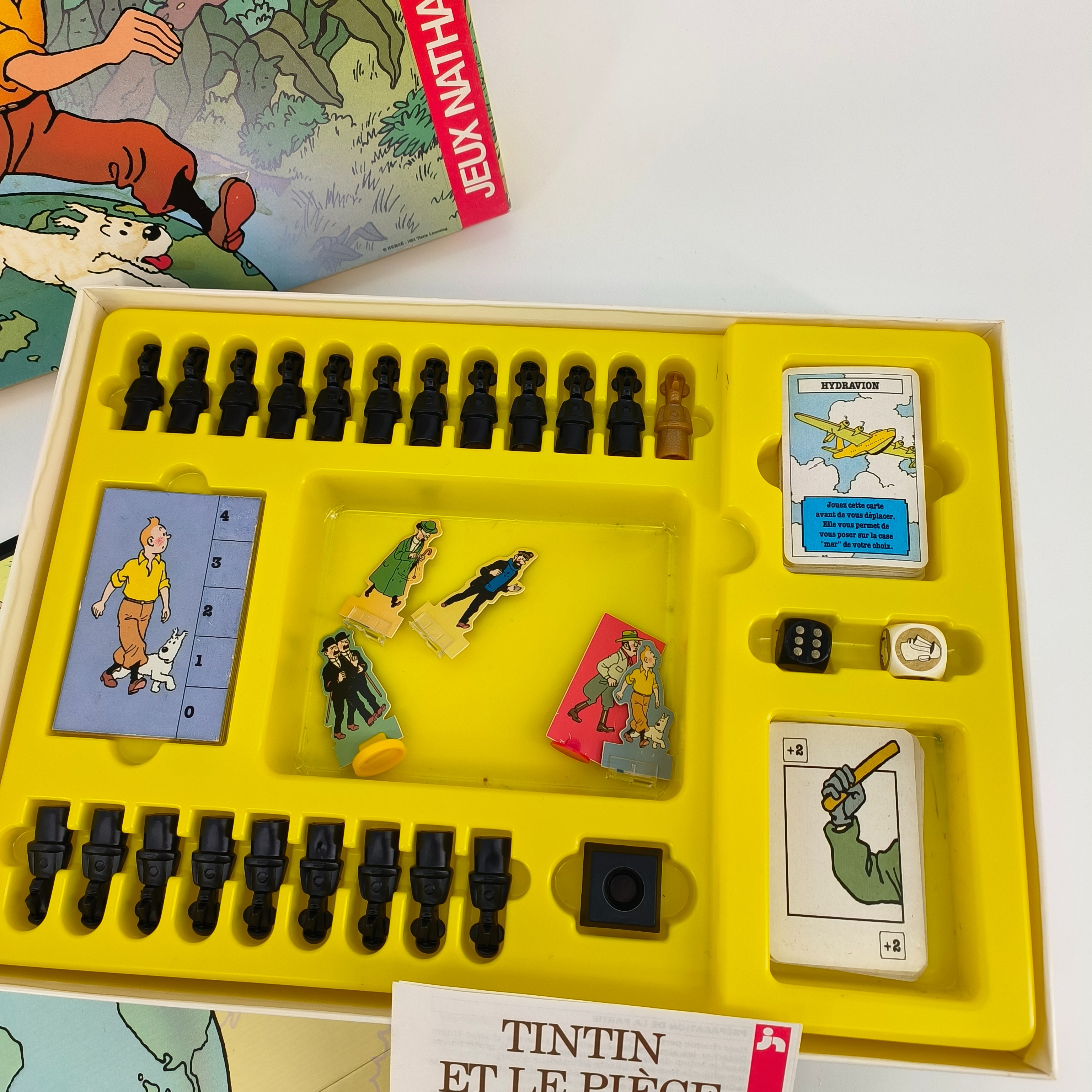 Voir photo 6 de Jeu de société-"Tintin et le piège du totem dhor"- Nathan-à partir de 7 ans Jeu de société-"Tintin et le piège du totem dhor"- Nathan-à partir de 7 ans Bon état - Vue 6 -