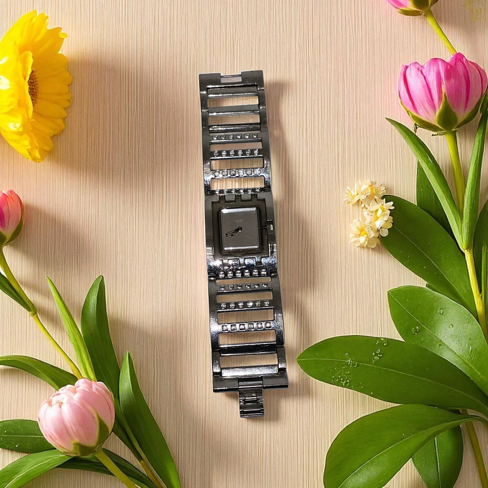 Voir photo 2 de Montre bracelet Swatch Suisse AG 2005 vintage Montre bracelet Swatch Suisse AG 2005 vintage Très bon état - Vue 2 -